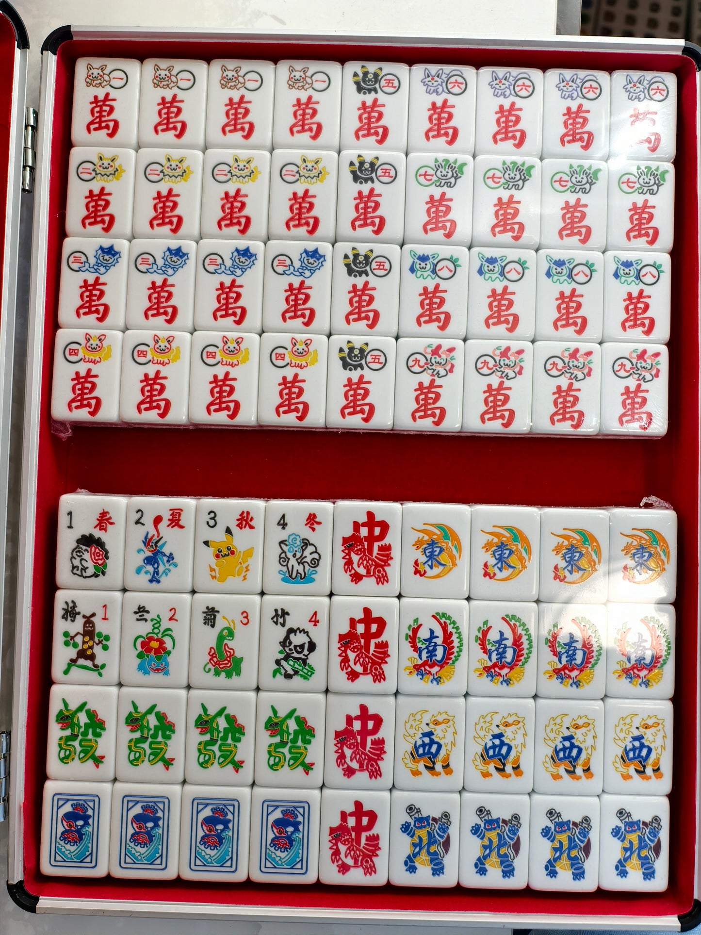 40mm The Pokemon Mahjong set comes with an aluminum box